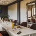 Hotel Restaurant Au Riesling meeting room in Riquewihr with long conference table and wall-mounted TV
