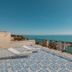 Domus Maris Relais Boutique Hotel in Sciacca: rooftop terrace with loungers and sea view