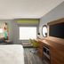 Hampton Inn & Suites Ft. Lauderdale Airport/South Cruise Port guest room with desk and TV in Hollywood