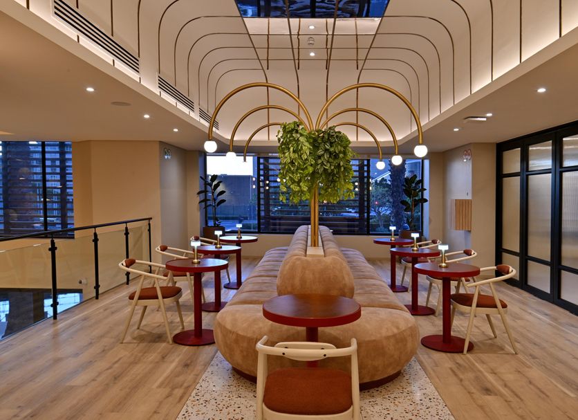 City Lodge Hotel Victoria and Alfred Waterfront in Cape Town lobby with curved seating and hanging greenery