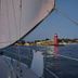 Sailboat view of South Haven lighthouse at dusk from Glenn Meadow Bed and Breakfast