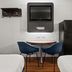Studio 6 San Luis Obispo Ca South room with TV, mini fridge, table and two chairs