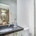 Hotel Praia Bonita Jatiúca bathroom with granite vanity, sink, toilet, and glass shower in Maceió