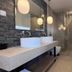 Hotel Roumani, Spétses: modern bathroom with double sink vanity and glass-enclosed shower