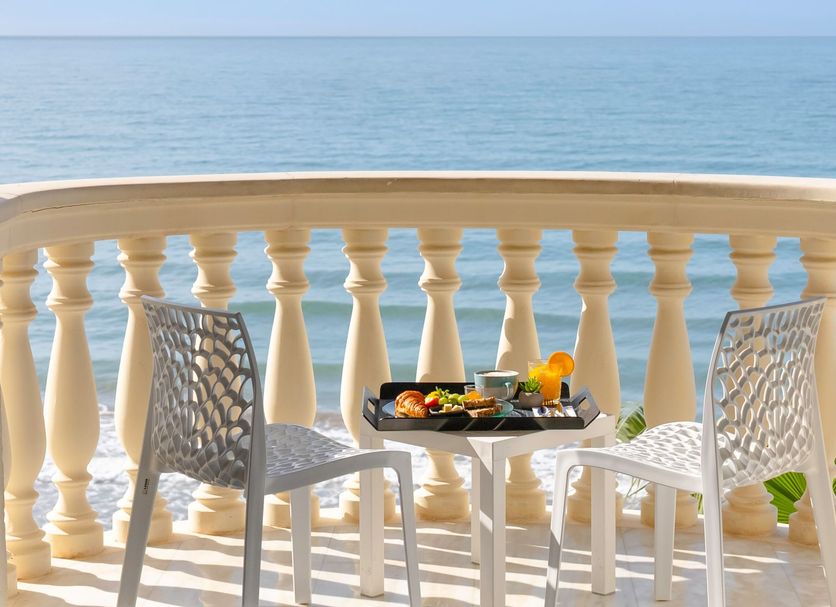 URH Sitges Playa in Sitges: balcony breakfast table overlooking the sea