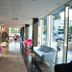 Hotel Bavaria Blu in Mamaia lobby lounge with colorful chairs and floor-to-ceiling windows