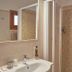 Bel Sole, Civitavecchia bathroom with sink, mirror and tiled shower stall