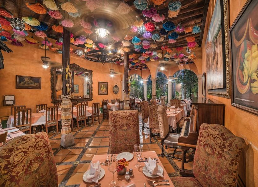 Hotel Posada del Hidalgo by Balderrama Hotel Collection in El Fuerte, colorful dining room with floral ceiling decor