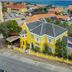 Boutique Hotel 't Klooster in Willemstad, yellow historic building near the waterfront and sea