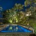 Felissimo Exclusive Hotel in Balneário Camboriú with illuminated outdoor pool and tropical landscaping