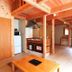 Tengu Onsen Asama Sanso in Komoro: rustic wooden guest room with kitchenette and loft sleeping area
