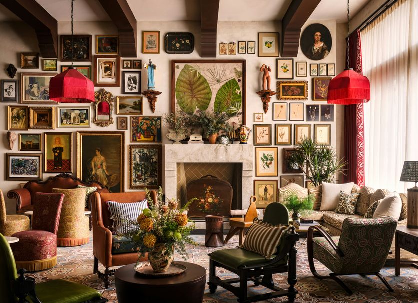 Graduate by Hilton Palo Alto lounge with gallery wall, fireplace, and red pendant lights