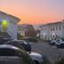 Pousada Fortaleza in Paraty with white guest buildings and parked cars at sunset