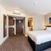 Canterbury Bell, Margate by Marston's Inns guest room with king bed and bathroom doorway in Broadstairs