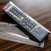 APA Hotel Kanazawa Nishi remote control on a wood-grain surface