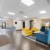 Comfort Inn Aikens Center in Martinsburg lobby seating area with colorful armchairs and coffee table