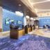 Resorts World Catskills lobby in Monticello with front desk and blue wave-pattern wall