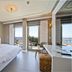 Samira Exclusive Hotel & Apartments in Kalkan bedroom with sea-view balcony and twin windows