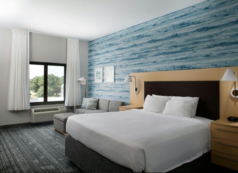 TownePlace Suites by Marriott Savannah Airport guest room with king bed, sofa, and window view in Savannah