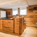 Residence Plein Soleil in Villarodin-Bourget hotel reception with wood-paneled walls and counter