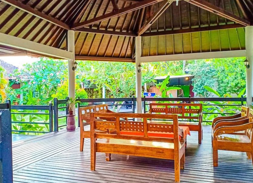 Mascot Hotel Senggigi in Mataram features an open-air wooden pavilion with benches and garden views.
