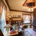 Stewart Inn Wausau cozy guest room with brick fireplace, bookshelves, and seating area