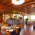 Hotel-Apartamento Rural Atxurra in Bermeo: rustic dining room with bar, wooden beams and tiled floor