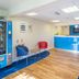 Travelodge Burton M6 Northbound lobby with reception desk, vending machine and seating area in Carnforth