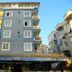 Best Life Apart Hotel in Alanya, blue mid-rise hotel with balconies and street-level entrance