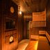 Dormy Inn Express Sendai Seaside in Sendai: wood-paneled sauna room with warm lighting