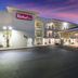 Red Roof Inn Albuquerque - Midtown exterior with covered entrance and lit balconies at dusk