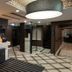 Apa Hotel Tokyo Ojima lobby with check-in counter, mirrored columns and patterned tile floor in Tokyo