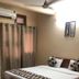 Goroomgo Mourya Inn Madhya Pradesh room in Harda with double bed, curtains, ceiling fan and AC