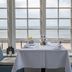 Hjerting Badehotel in Esbjerg dining table by large windows with sea view
