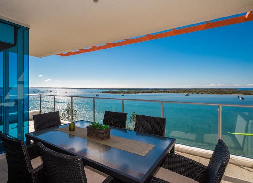 Silvershore Apartments on the Broadwater in Biggera Waters: balcony dining table with oceanfront views