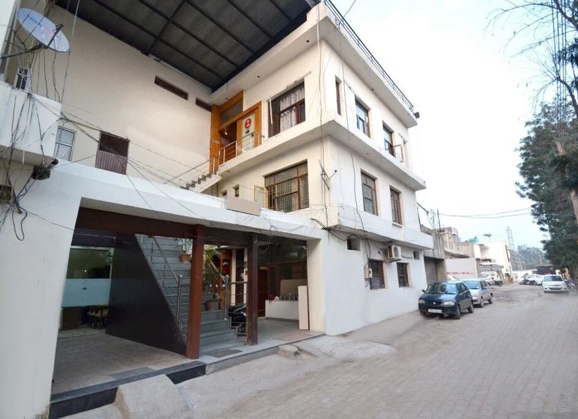 Hotel Golden Inn Chandigarh exterior with covered entrance and street parking