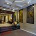 Vong Xua Hotel Hanoi lobby with steps, decorative wall art and patterned ceiling