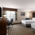 La Quinta Inn & Suites by Wyndham Bakersfield North guest room with two beds and desk, Bakersfield