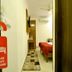 Hotel Golden Inn Chandigarh guest room with bed, wall TV, air conditioner and do not disturb sign