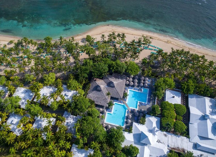 Aerial view of Playabachata Resort in Puerto Plata with pools, palm trees and a beachfront