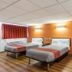 Motel 6 Elizabeth NJ Newark Liberty Intl Airport room with two beds and orange walls