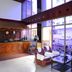 Hotel City Tower Coimbatore lobby with carved wood reception desk and seating area