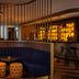 DoubleTree by Hilton Hull lounge with curved blue banquette, pendant lights and bar seating