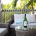 Crane's Beach House Boutique Hotel & Luxury Villas in Delray Beach, outdoor wicker seating with patio table