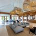 Sunwing Bangtao Beach (SHA Plus+) in Choeng Thale lobby with gray sectional seating and warm wood reception