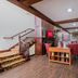 Lobby seating area at Red Roof Inn & Suites Stafford, VA - Quantico in Stafford with staircase and wood floors
