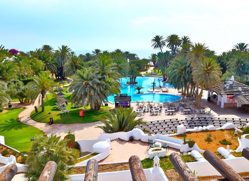 Odyssee Resort and Thalasso in Zarzis with palm gardens, pools, and sun loungers