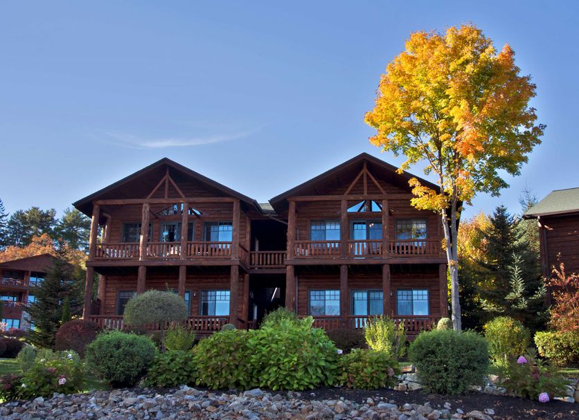 The Lodges at Cresthaven in Lake George, two-story lodge buildings with balconies and autumn trees