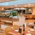 Pestana São Paulo buffet restaurant with open kitchen and dining tables in Sao Paulo