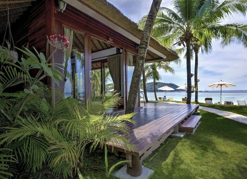 Mali Resort Pattaya Beach Koh lipe beachfront bungalow with wooden deck and palm trees on Ko Lipe